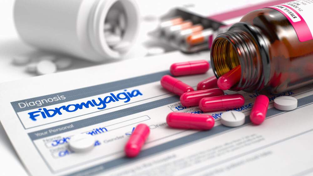 Handwritten diagnosis and pills for managing fibromyalgia pain