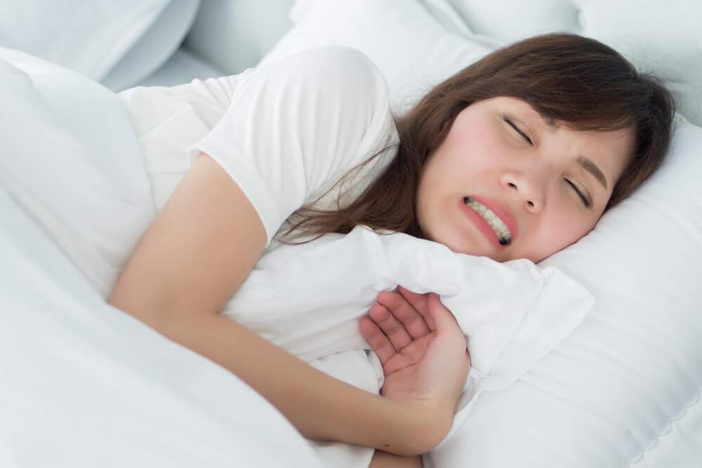 Grinding teeth during sleep almagia
